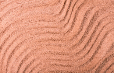 Background with abstract texture, ridges on the surface of sand, close-up, top view, coral color, horizontal, without people,