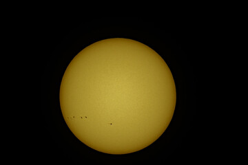 Sunspots are temporary phenomena on the Sun's photosphere that appear as spots darker than the surrounding areas. They are regions of reduced surface temperature caused by concentrations of magnetic f