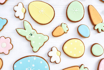 Easter greeting card with gingerbread cookies. Easter spring decorative composition with homemade easter cookies in shape of funny rabbit and eggs