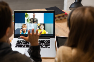 video conference call with pupil using webcam. Online education and e-learning concept. Home...