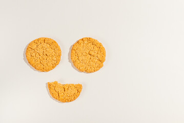 Round cookies over white background, top view.Copy space.