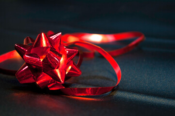 Background red bow and shiny satin with shadow