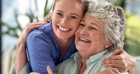 She couldnt been any happier with her results. 4k video footage of a smiling doctor hugging a senior woman in a hospital after giving her some good news. - Powered by Adobe