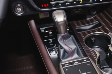 Detail of modern car interior, gear stick, automatic transmission in expensive car