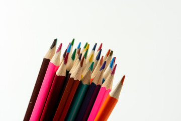 Colored pencils in a stack isolated on a white background. close-up, copy space