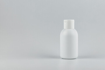 Unbranded white plastic flacon for cosmetics products.  Skincare and cosmetology mockup with copy...