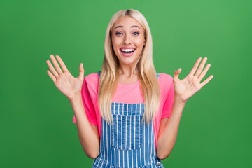 Photo of crazy excited cute charming lady sale wow reaction raise hands wear striped overall...