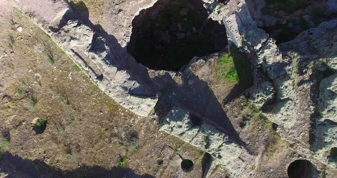 Aerial top view historical, antique ruins.  Historical-archeological museum-reserve, Armenia. Ruins of Observatory in Metsamor hillfort. The excavated cultural layers refer to the Bronze Age.