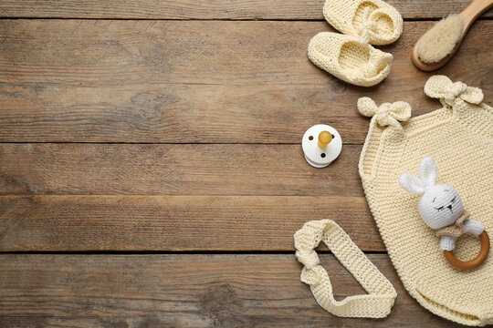 Cute Baby Stuff On Wooden Background, Flat Lay. Space For Text