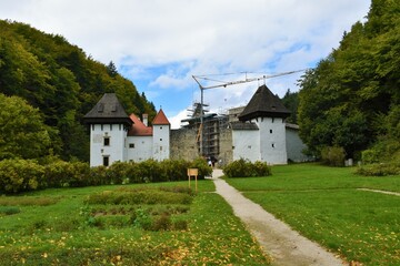 Fototapeta na wymiar View of and old medieval monastery complex with the central part under renovation at Zicka kartuzija near Slovenske konjice, Slovenia