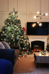 Cozy living room interior with beautiful Christmas tree near fireplace
