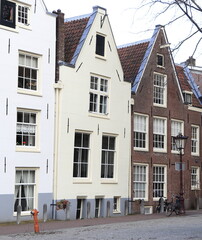 Fototapeta na wymiar Amsterdam Spui Square Historic Building Facades with White and Brown Spout Gables, Netherlands