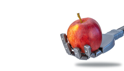 fingers squeeze a fresh apple in the robots hand. future technologies and ecology. robotics applicable in agriculture and natural products trade. artificial intelligence and nature.