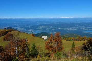 Austrian region of Carithia with snow mountain peaks in the alps from Karavanke mountains in autumn