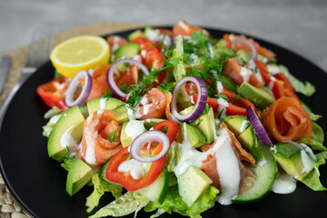Vegetable salad with smoked salmon and fresh vegetables.