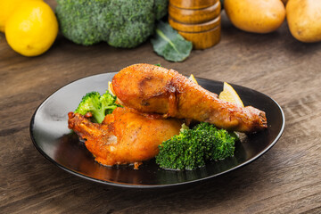 Grilled chicken leg with boiled potatoes and vegetable