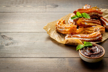 Spanish churros waffles on baking paper, top view