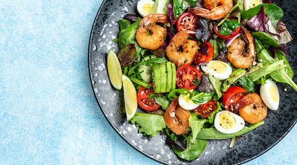 Dietary menu. Healthy salad with cherry tomatoes, cucumber, avocado, eggs and smoked shrimps. Paleo diet menu. Healthy food trend. place for text. Top view