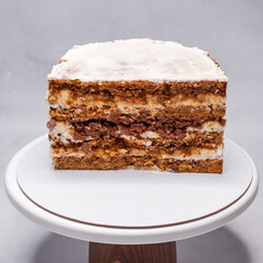 Homemade walnut cake in a section on a stand