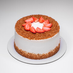 homemade honey cake decorated with strawberry slices