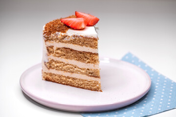 homemade honey cake decorated with strawberry slices