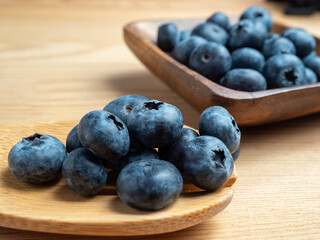 Blueberries in a wooden bowl.