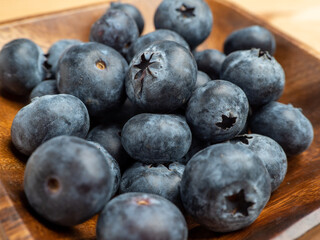 Blueberries in a wooden bowl.