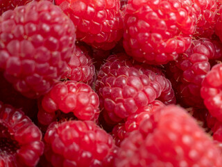 Raspberries in a wooden bowl.