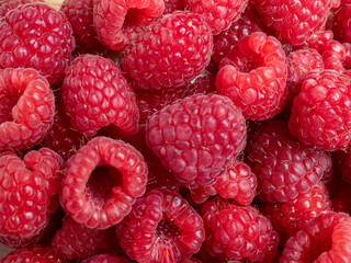 Raspberries in a wooden bowl.