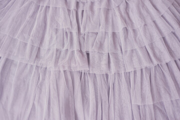 Background of purple tulle with flounces - obrazy, fototapety, plakaty