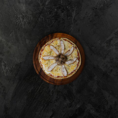 chicken cheese and mushroom pizza, top view. mozzarella cheese and tomato sauce. dark background top view