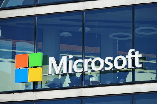 Microsoft logo company on the window facade of the new Microsoft headquarter, in Milan. MILAN, ITALY - march 2020