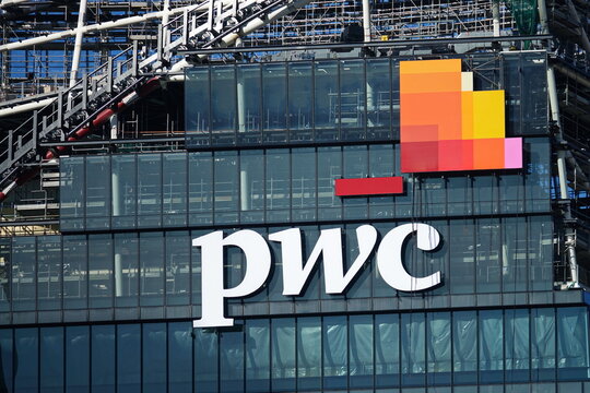 Exterior sign for PWC Price Waterhouse Coopers accounting firm Milan headquarters. Milan, Italy - march 2020