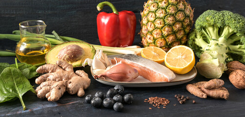 Healthy vegetables, fish, fruits, nuts and spices, food for an anti-inflammatory and antioxidant...