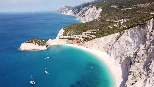 Aerial Drone View of Porto Katsiki Beach, Ionian Lefkada Island, Greece - Steep Rocky Cliffs, Sailboats, Coastline and Turquise Blue Sea