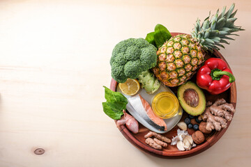 Round tray with anti-inflammatory and antioxidant food, healthy eating for the immune system with...