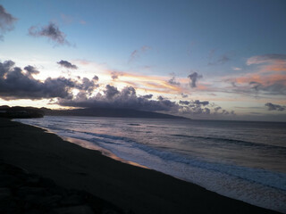 Beautiful sunset over beach in Ribiera Grande, Atlantic Ocean, Azores Islands.
