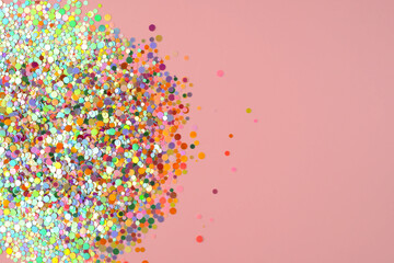 Colorful confetti on pink background. Cute festive background