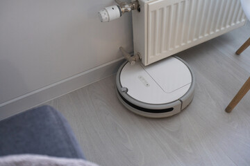 robotic vacuum cleaner on laminate wood floor smart cleaning technology
