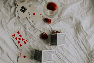 playing cards on white table fine art flatlay
