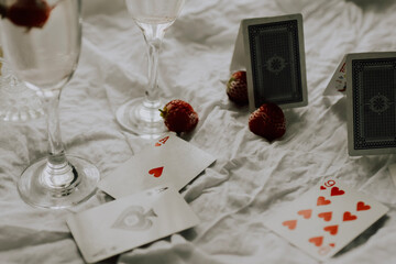 playing cards on white table fine art flatlay