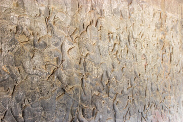 Close-up view of a pictorial story engraved on the wall of Angkor Wat.