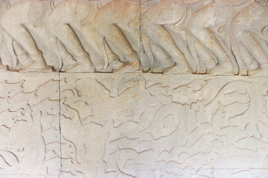 Close-up view of a pictorial story engraved on the wall of Angkor Wat.
