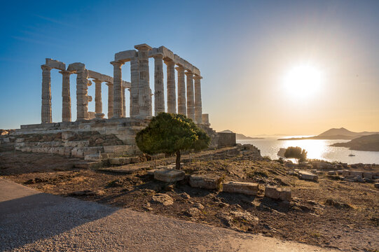 Ancient marble temple of Poseidon at sunset - Cape Sunion, Attica, Greece