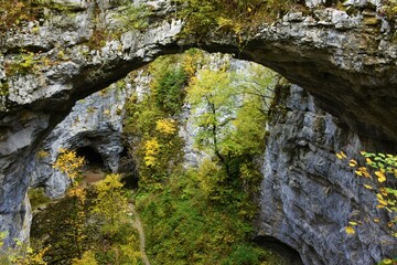 View of Zeljske jame with the little natural bridge above in Rakov Skocjan in Notranjska, Slovenia in autumn
