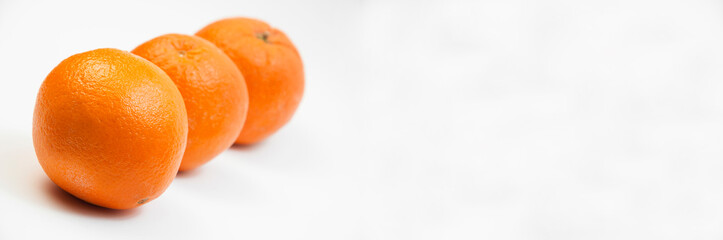 juicy oranges on a white background. sweet big tangerines on the table.orange citrus fruits on a light texture