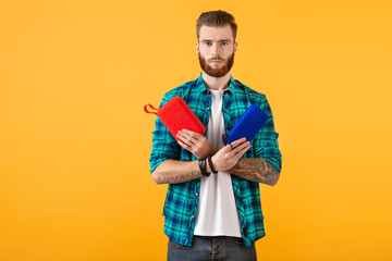 stylish young man holding wireless speakers