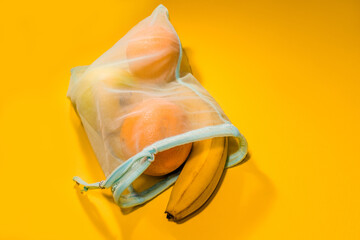  Fruits in a disposable bag on a yellow background. High quality photo