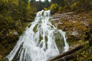 Waterfall bellow Planina Blato in Julian alps and Triglav national park in Slovenia in autumn