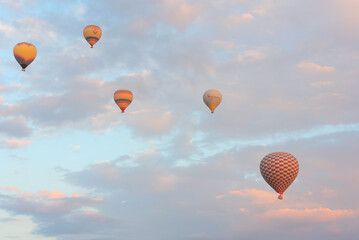 Hot air balloons in the sky during sunrise. Travel, dreams come true concept